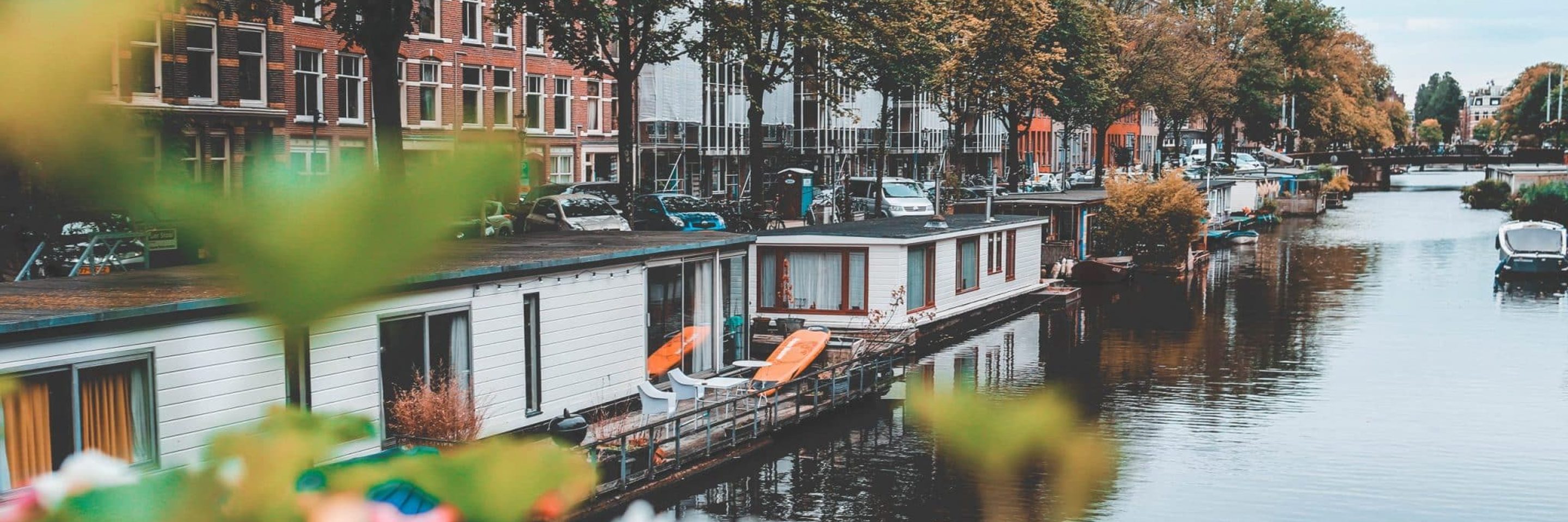 Amsterdam houseboats Nastya Dulhiier scaled