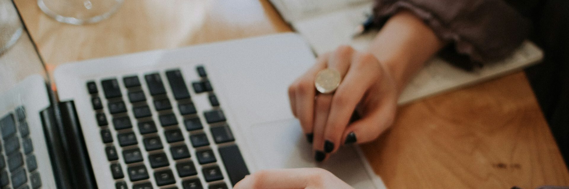 Laptop with woman hands