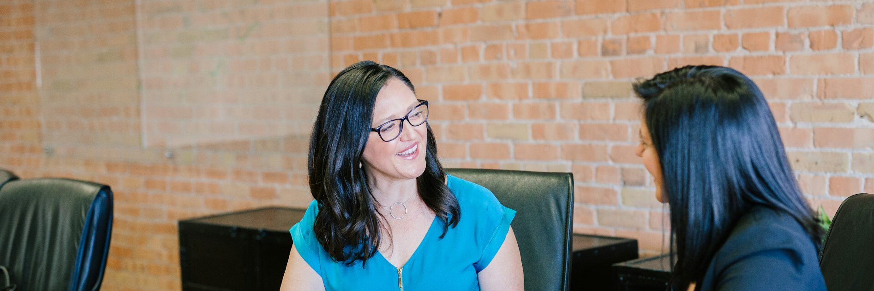 Two people talking about payroll