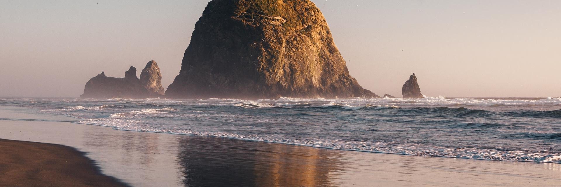 Rock formation beach against clear sky
