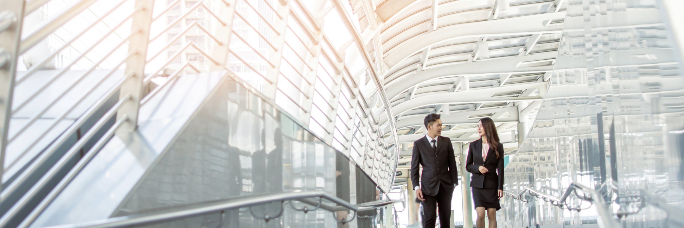 two people male female talking walking