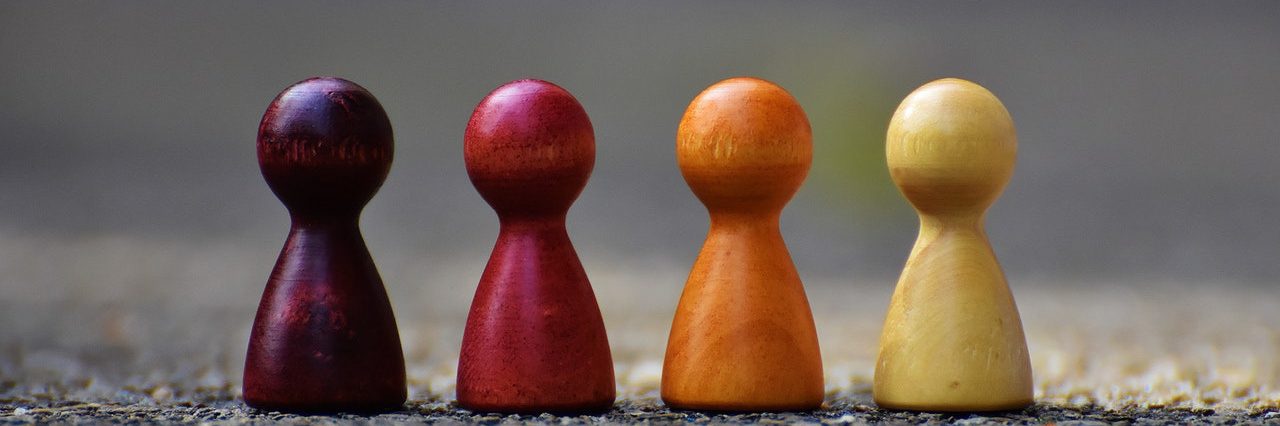 Focus photo of 4 wooden pawn figurine 209728 edited