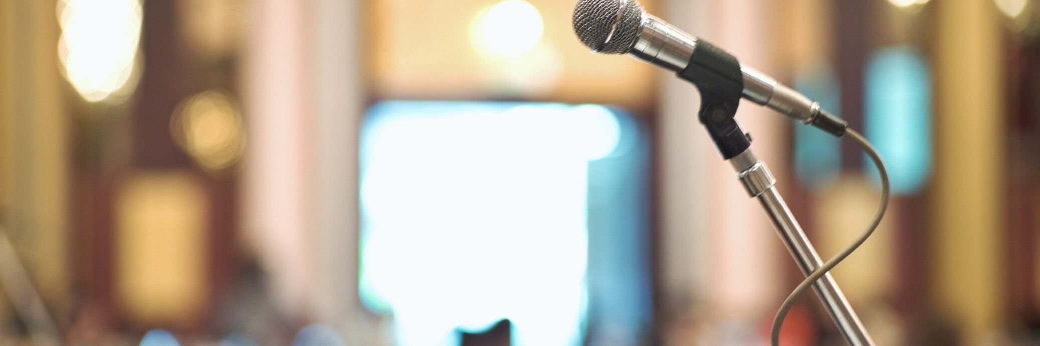 Selective focus on microphone stands on the conference hall for communicating with the lecturer with t20 o RB6r P